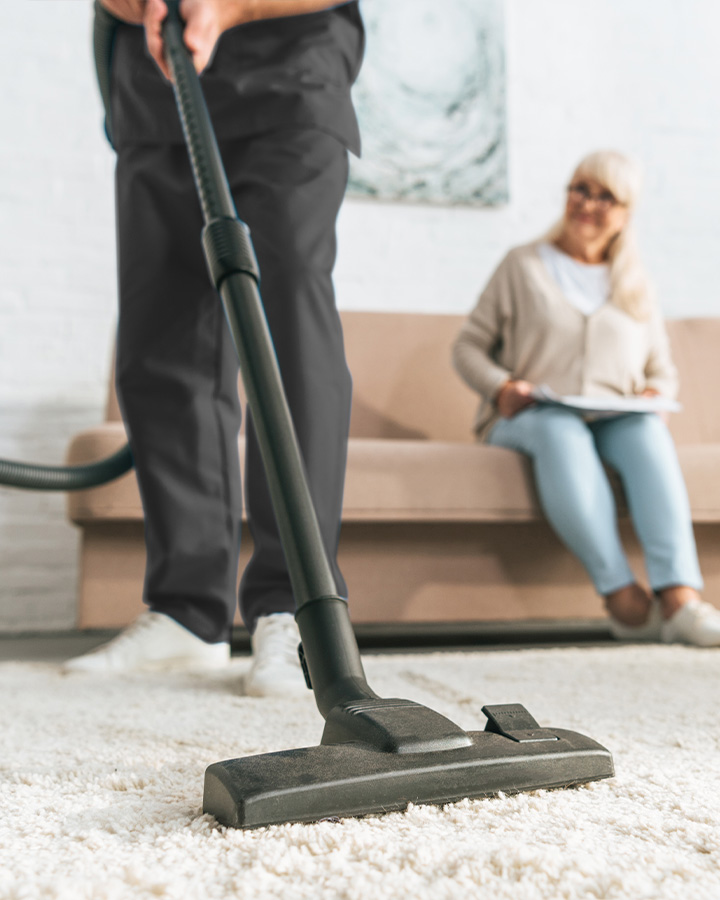 Vacuuming house carpet