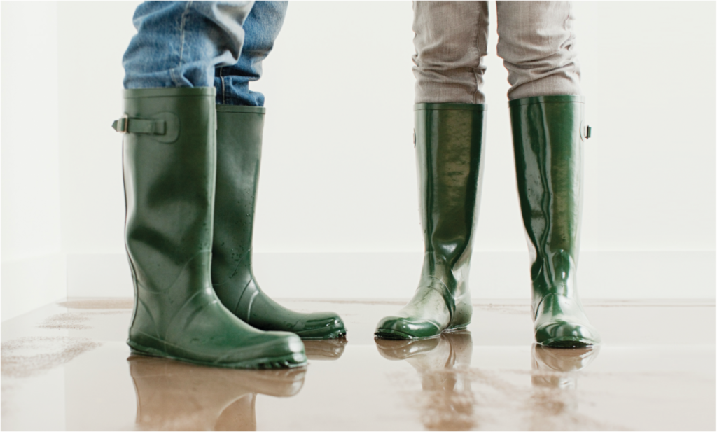 Two pairs of green rubber boots