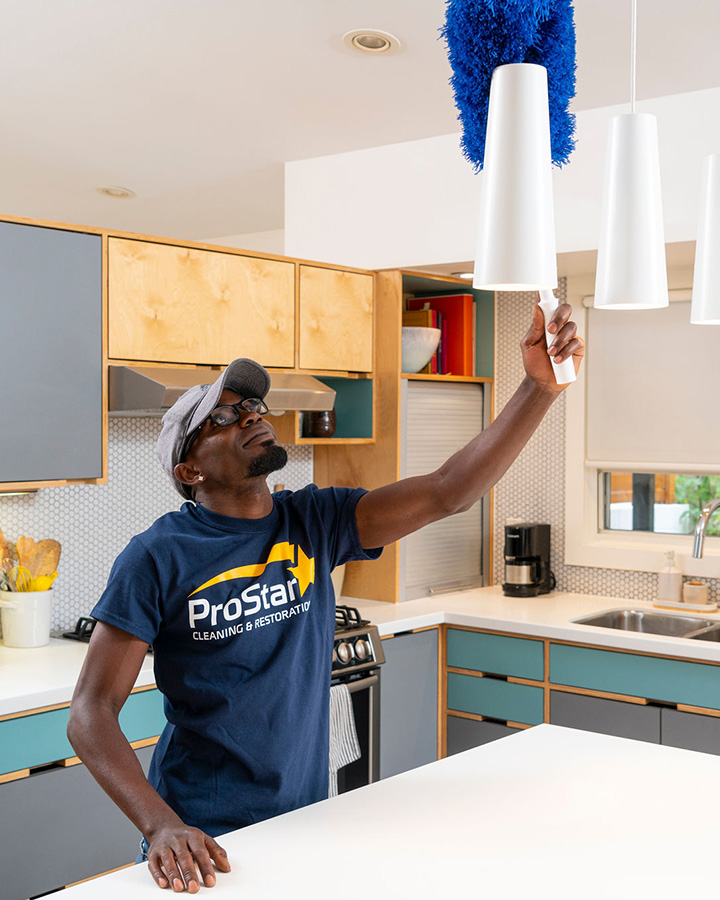 Dusting kitchen light fixture